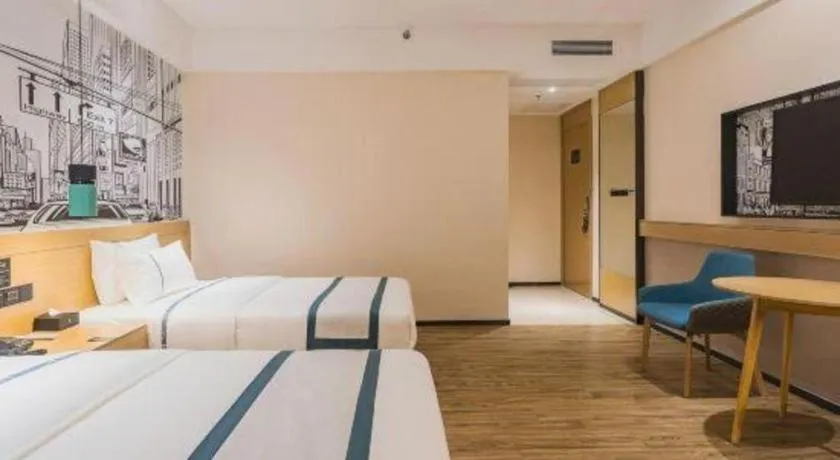 Bed in City Comfort Inn Dongguan Wangniudun
