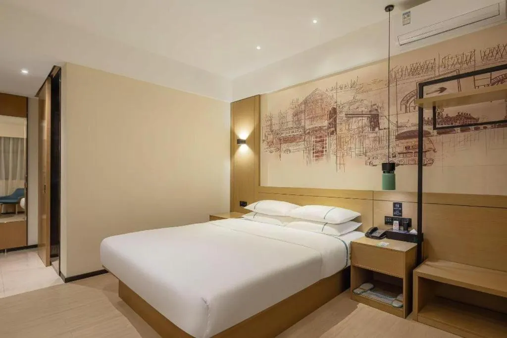 Bed in City Comfort Inn Dongguan Wangniudun