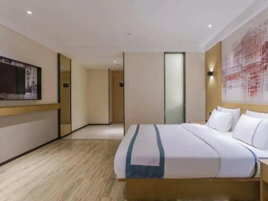 Bed in City Comfort Inn Dongguan Wangniudun