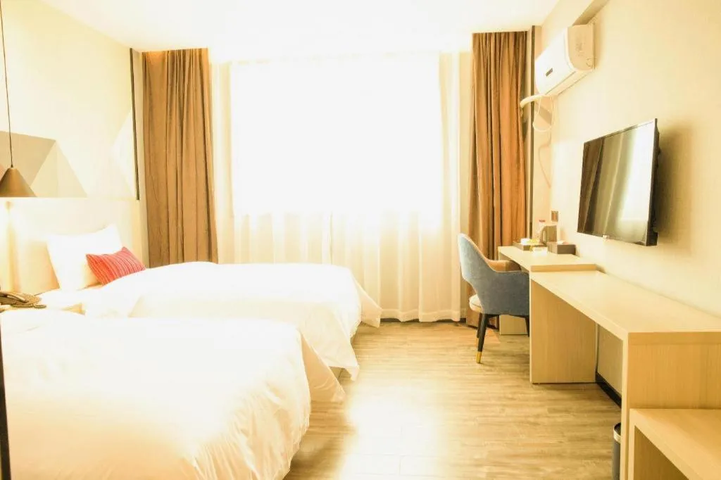 Bed in Borrman Hotel Dongguan Houjie Wanda Plaza Liaoxia Metro Station