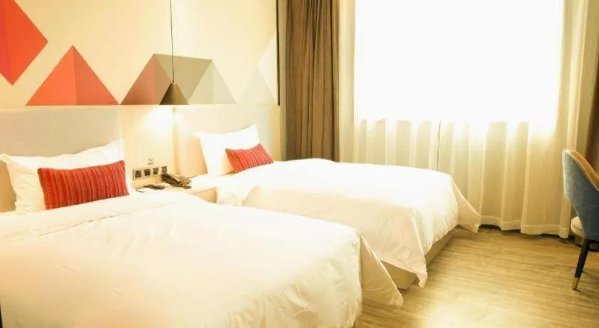 Bed in Borrman Hotel Dongguan Houjie Wanda Plaza Liaoxia Metro Station