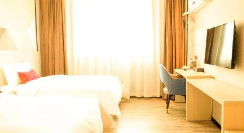 Bed in Borrman Hotel Dongguan Houjie Wanda Plaza Liaoxia Metro Station