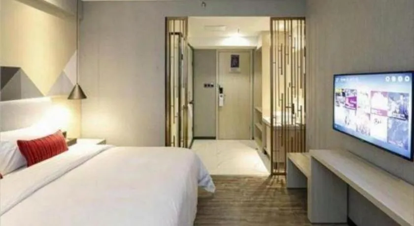 Bed in Borrman Hotel Dongguan Houjie Wanda Plaza Liaoxia Metro Station