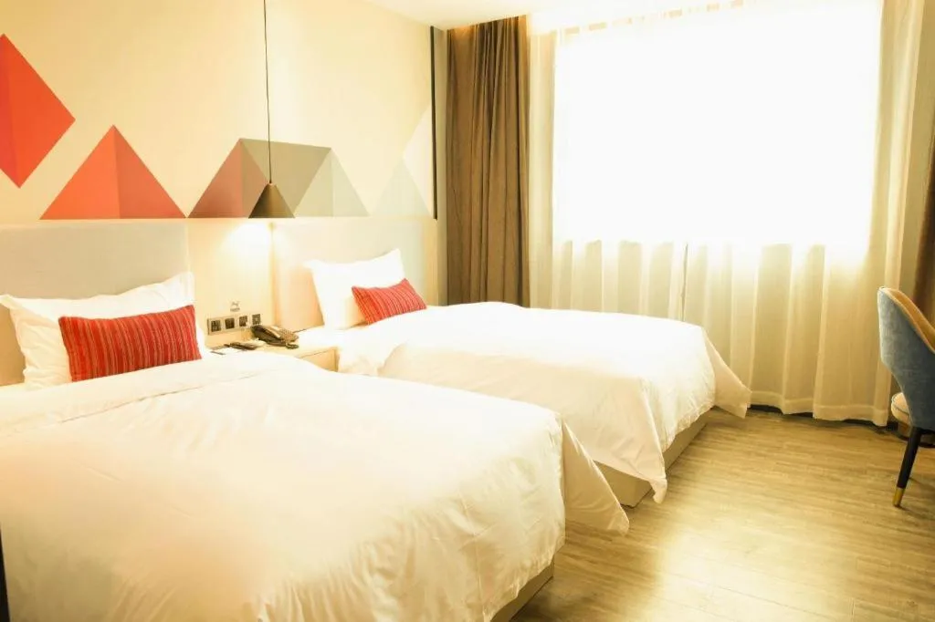 Bed in Borrman Hotel Dongguan Houjie Wanda Plaza Liaoxia Metro Station