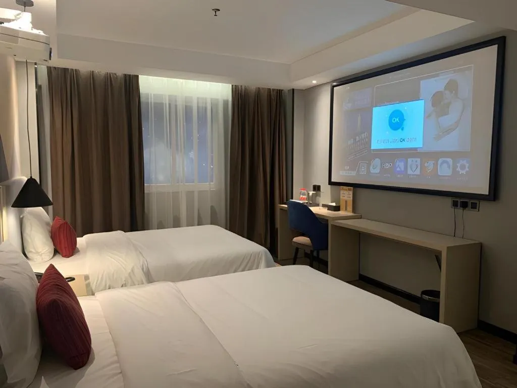 Bed in Borrman Hotel Dongguan Houjie Wanda Plaza Liaoxia Metro Station