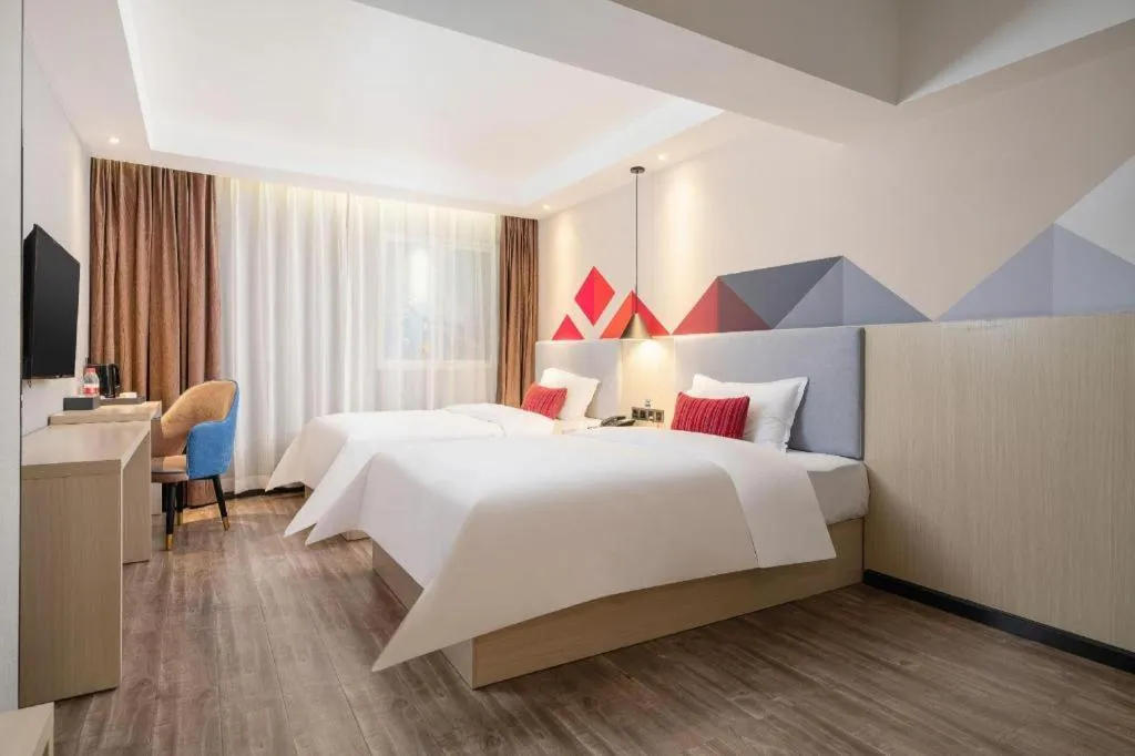 Bed in Borrman Hotel Dongguan Houjie Wanda Plaza Liaoxia Metro Station