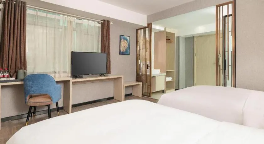 Bed in Borrman Hotel Dongguan Houjie Wanda Plaza Liaoxia Metro Station