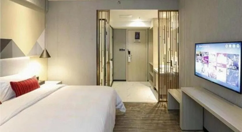 Bed in Borrman Hotel Dongguan Houjie Wanda Plaza Liaoxia Metro Station