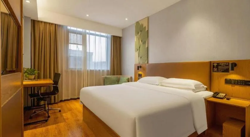 Bed in GreenTree Inn Express Fuzhou Le'an County Government Sijiu Square