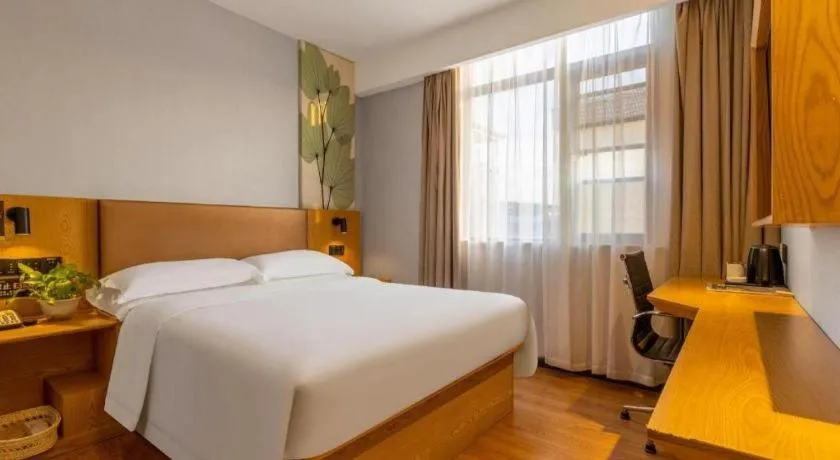 Bed in GreenTree Inn Express Fuzhou Le'an County Government Sijiu Square