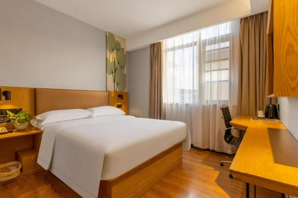 Bed in GreenTree Inn Express Fuzhou Le'an County Government Sijiu Square