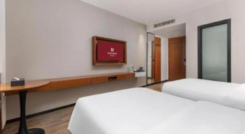 Bed in Borrman Hotel Guangzhou Southern Hospital Meihuayuan Metro Station