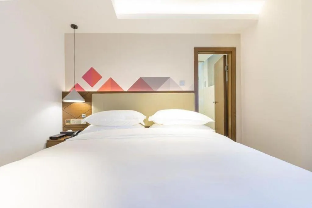 Bed in Borrman Hotel Guangzhou Southern Hospital Meihuayuan Metro Station