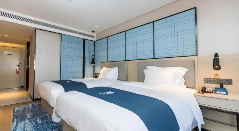 Bed in Echarm Hotel Shenzhen World Exhibition and Convention Center