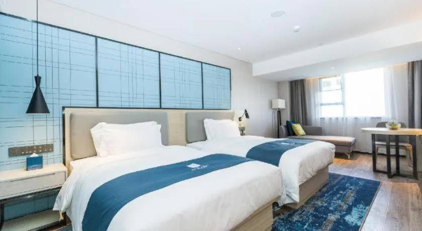 Bed in Echarm Hotel Shenzhen World Exhibition and Convention Center