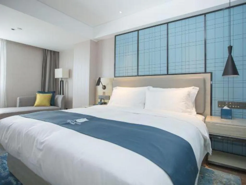 Bed in Echarm Hotel Shenzhen World Exhibition and Convention Center