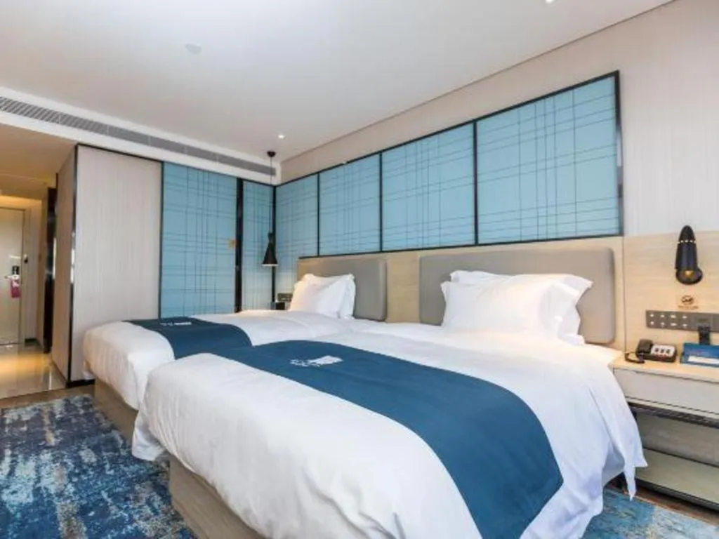 Bed in Echarm Hotel Shenzhen World Exhibition and Convention Center