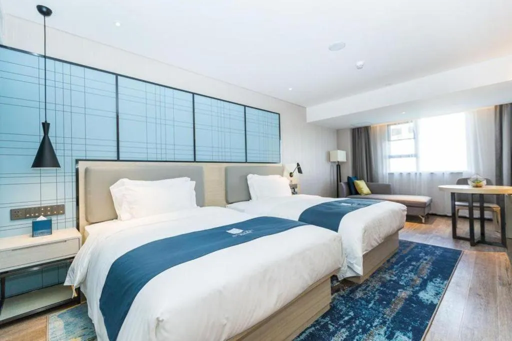 Bed in Echarm Hotel Shenzhen World Exhibition and Convention Center