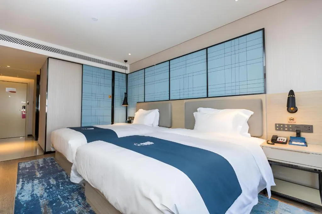 Bed in Echarm Hotel Shenzhen World Exhibition and Convention Center