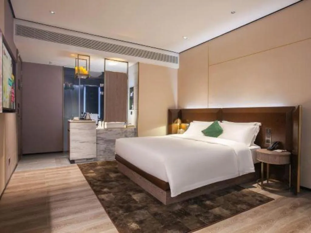 Bed in Echarm Plus Hotel Wuhan Wenhua Boulevard Dahualing Subway Statiom