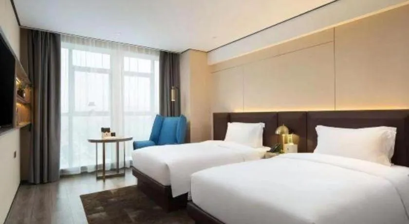 Bed in Echarm Plus Hotel Wuhan Wenhua Boulevard Dahualing Subway Statiom