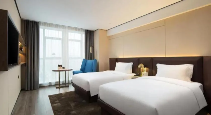 Bed in Echarm Plus Hotel Wuhan Wenhua Boulevard Dahualing Subway Statiom
