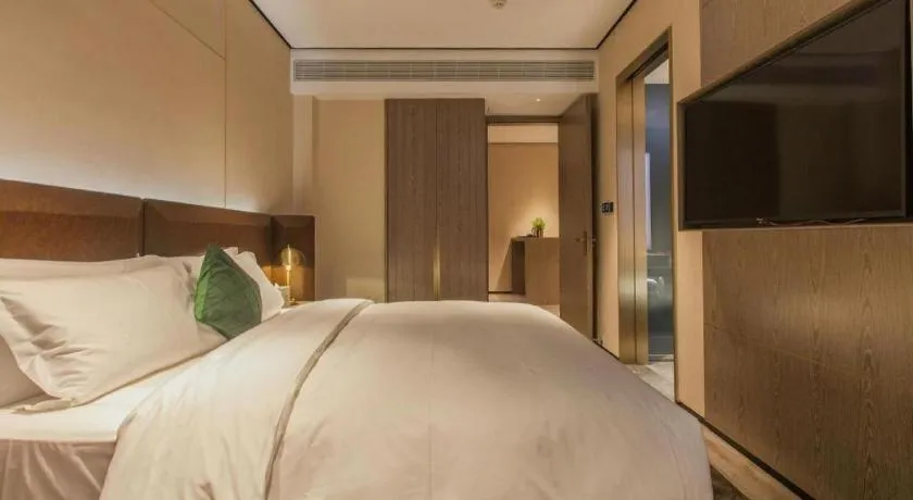 Bed in Echarm Plus Hotel Wuhan Wenhua Boulevard Dahualing Subway Statiom