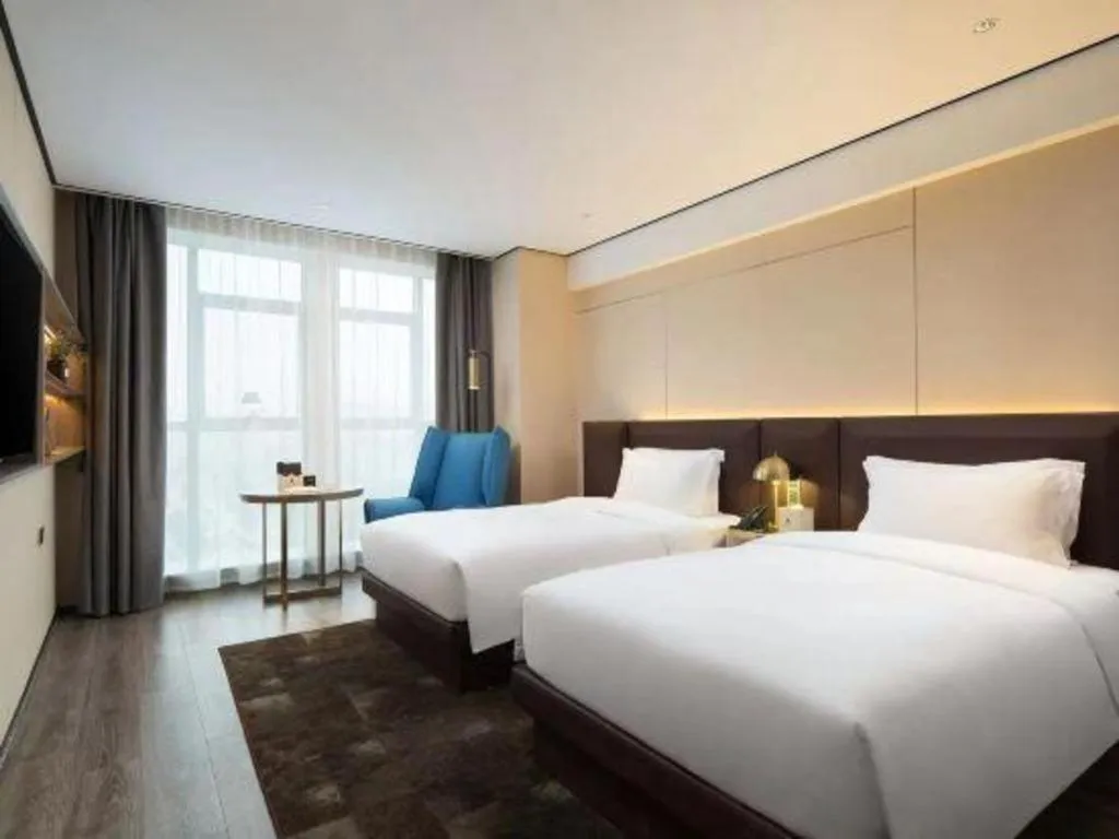 Bed in Echarm Plus Hotel Wuhan Wenhua Boulevard Dahualing Subway Statiom