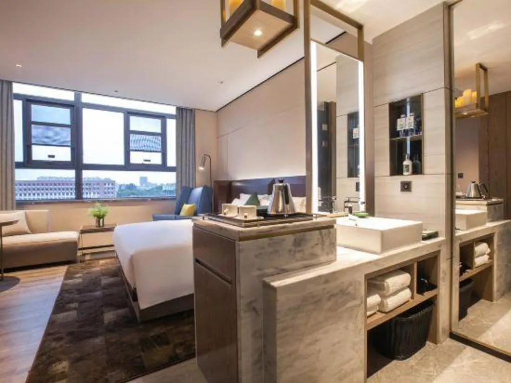 Bed in Echarm Plus Hotel Wuhan Wenhua Boulevard Dahualing Subway Statiom