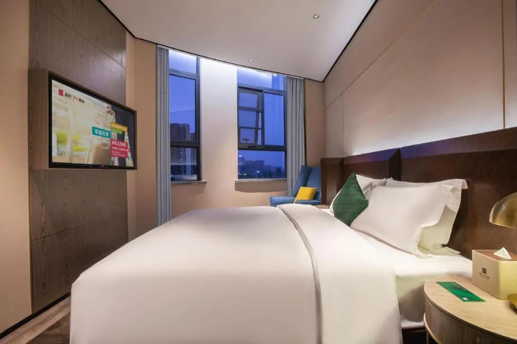Bed in Echarm Plus Hotel Wuhan Wenhua Boulevard Dahualing Subway Statiom