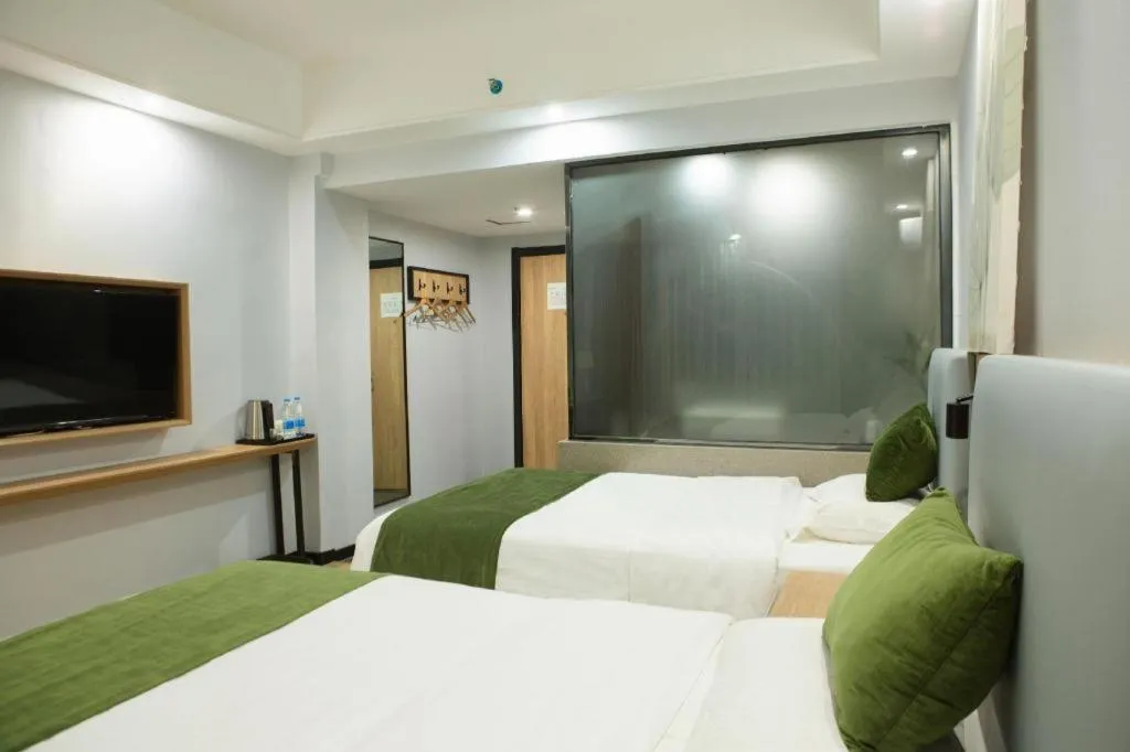 Bed in GreenTree Inn Express Hainan Haikou Haixiu Zhong Road