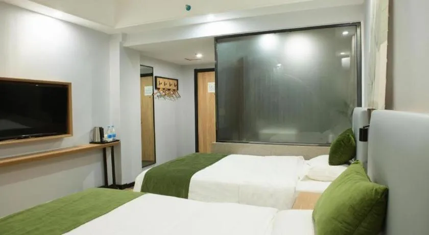 Bed in GreenTree Inn Express Hainan Haikou Haixiu Zhong Road