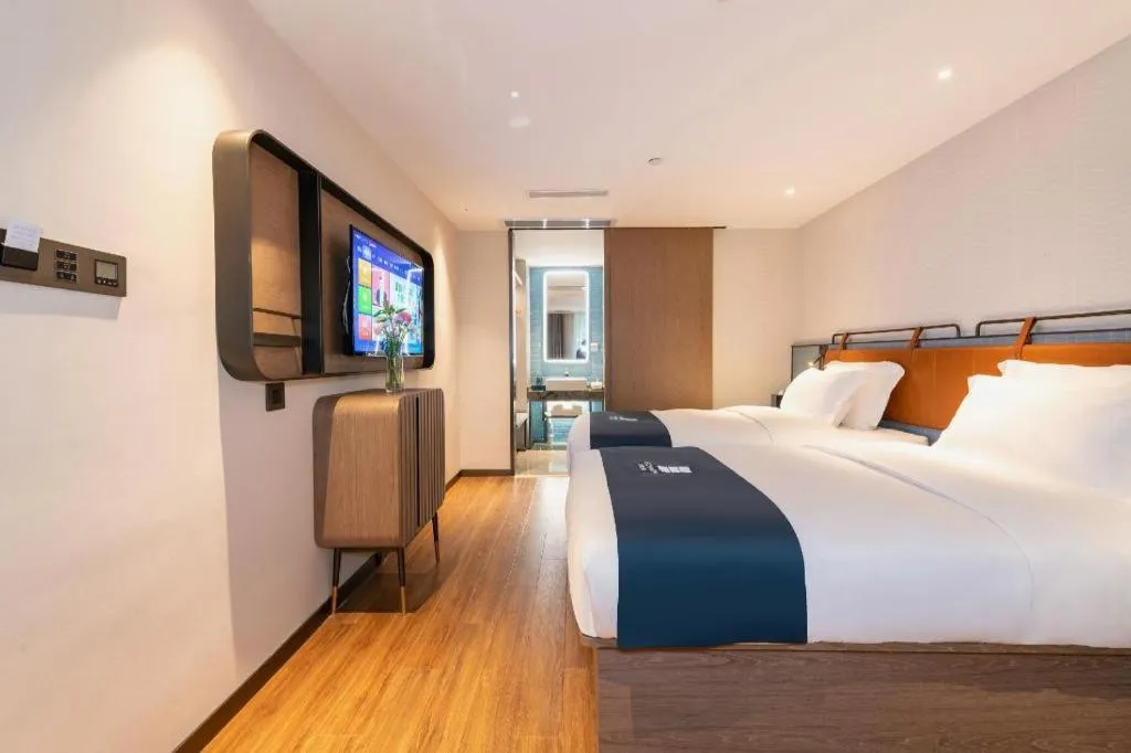 Bed in Echarm Hotel Guangzhou Tiyu West Raod Metro Station