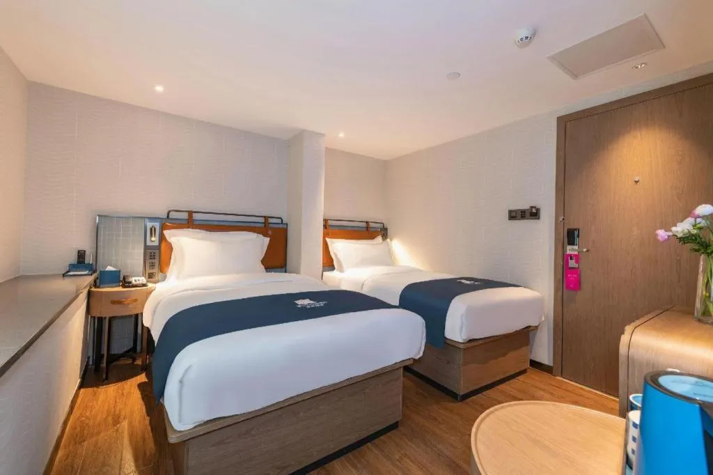 Bed in Echarm Hotel Guangzhou Tiyu West Raod Metro Station