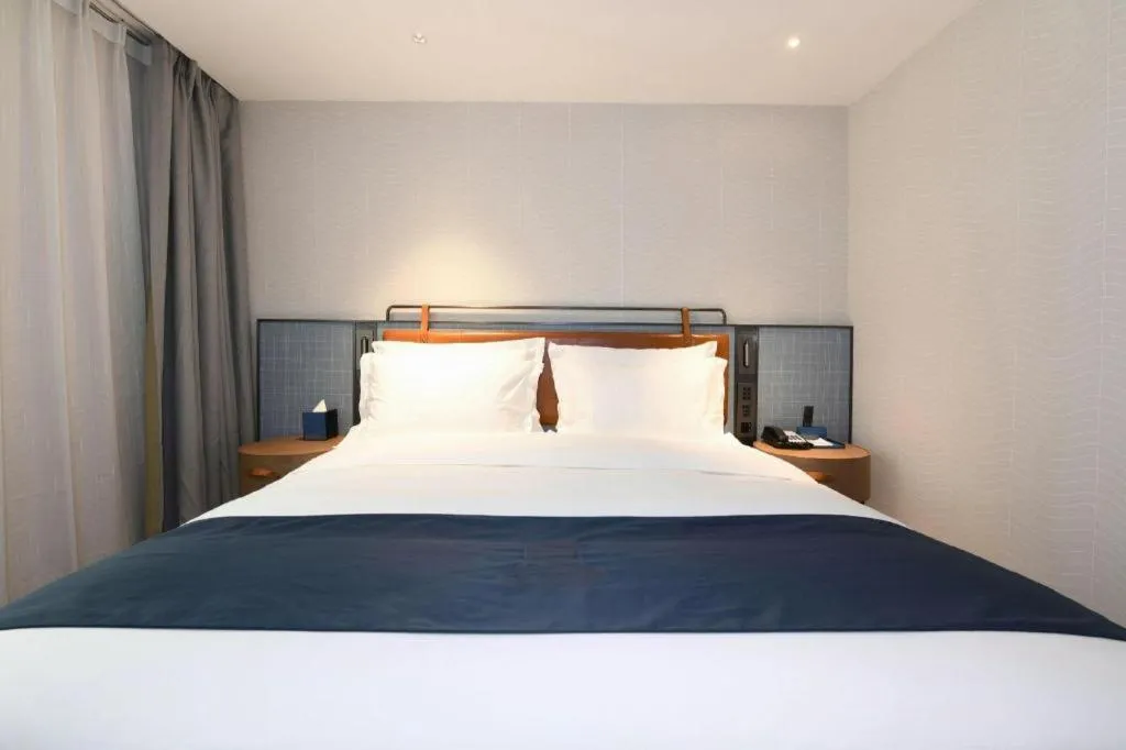 Bed in Echarm Hotel Guangzhou Tiyu West Raod Metro Station