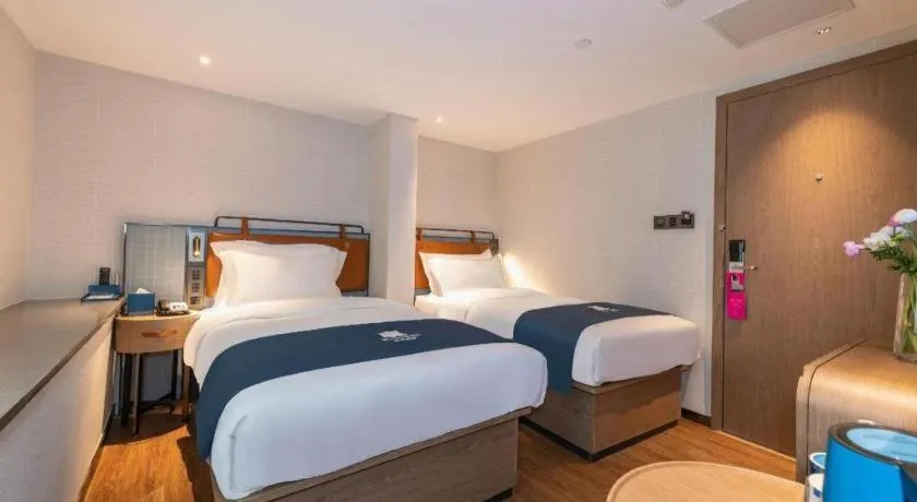 Bed in Echarm Hotel Guangzhou Tiyu West Raod Metro Station