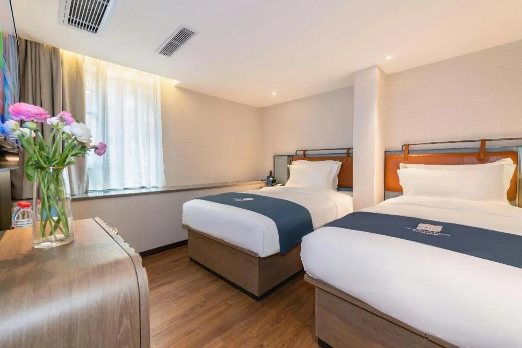 Bed in Echarm Hotel Guangzhou Tiyu West Raod Metro Station