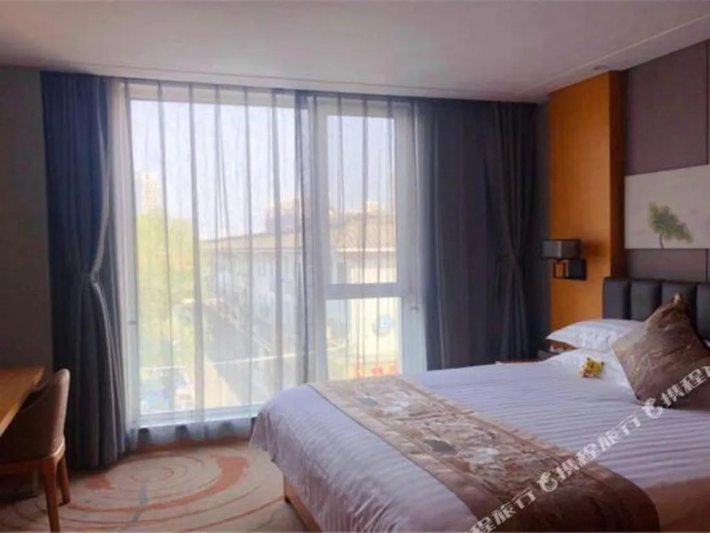 Bed in Borrman Hotel Jinan Yijia Exhibition Center Laotun Metro Station