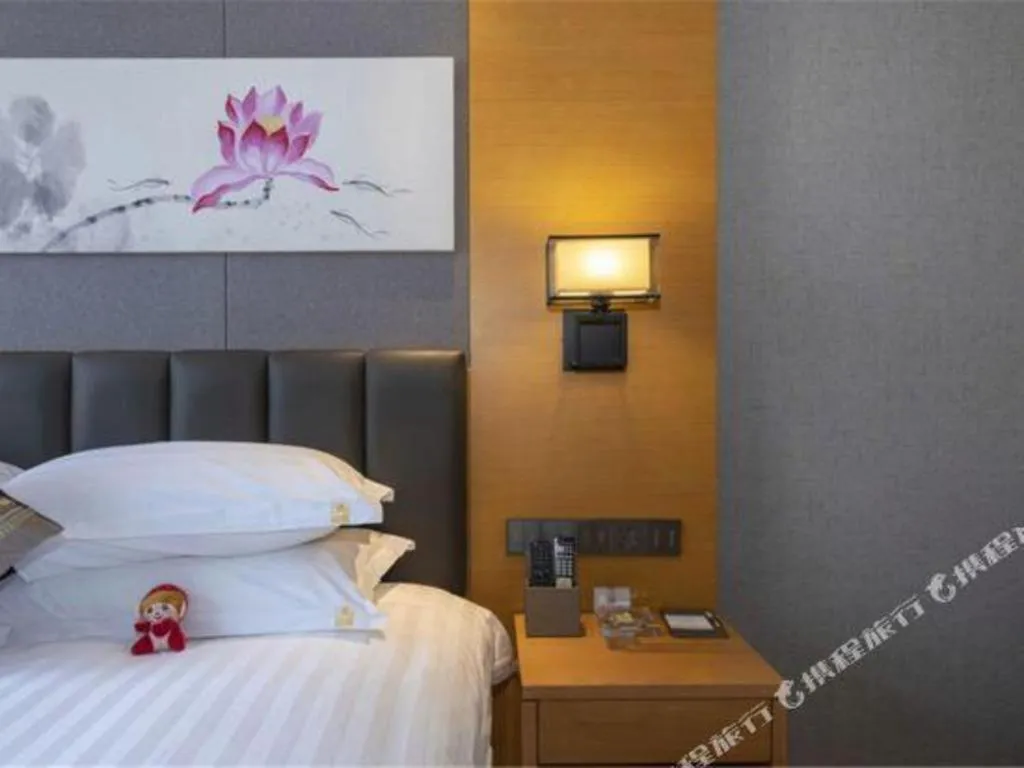 Bed in Borrman Hotel Jinan Yijia Exhibition Center Laotun Metro Station