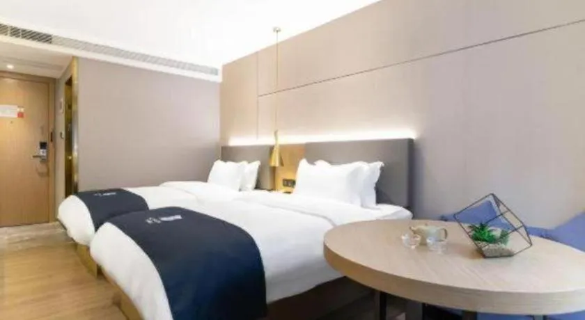 Bed in Echarm Hotel Guangzhou Gangding Huashi Metro Station