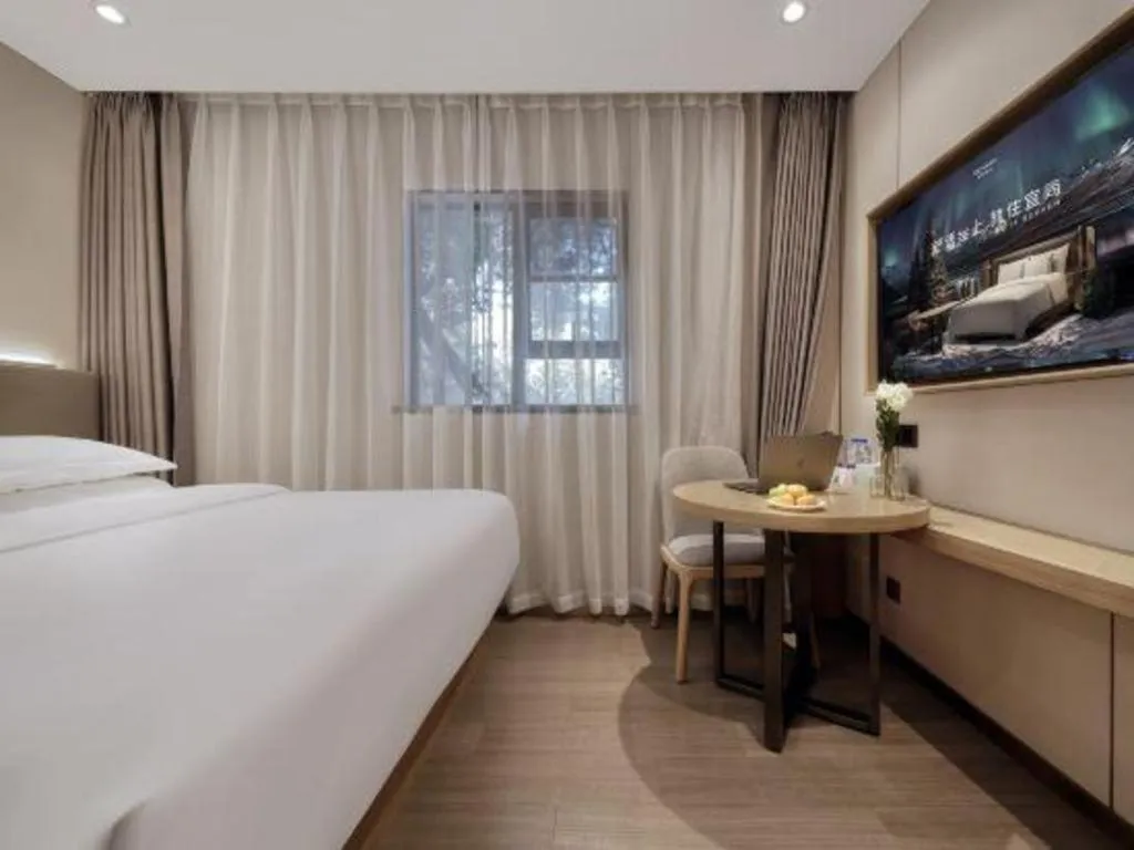 Bed in Echarm Hotel Guangzhou Gangding Huashi Metro Station