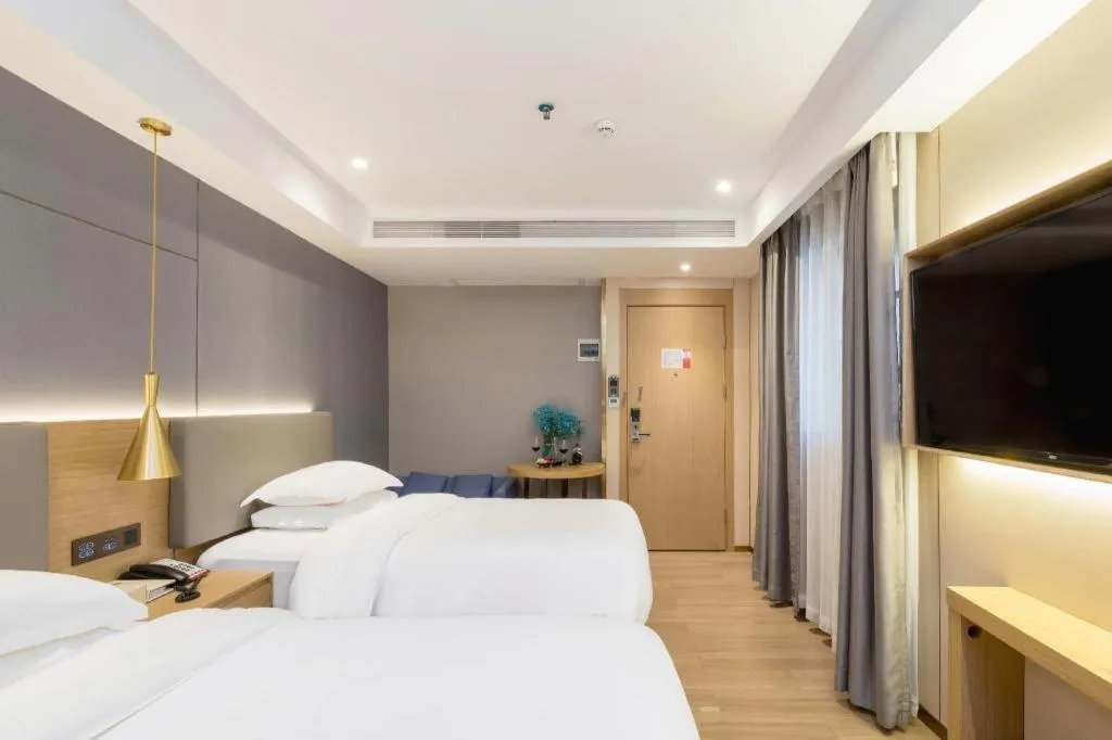 Bed in Echarm Hotel Guangzhou Gangding Huashi Metro Station