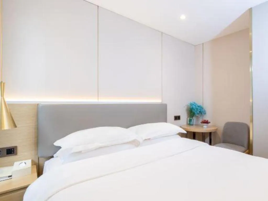 Bed in Echarm Hotel Guangzhou Gangding Huashi Metro Station