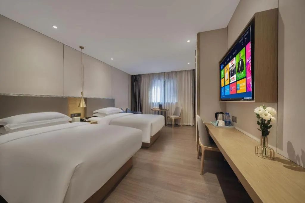 Bed in Echarm Hotel Guangzhou Gangding Huashi Metro Station