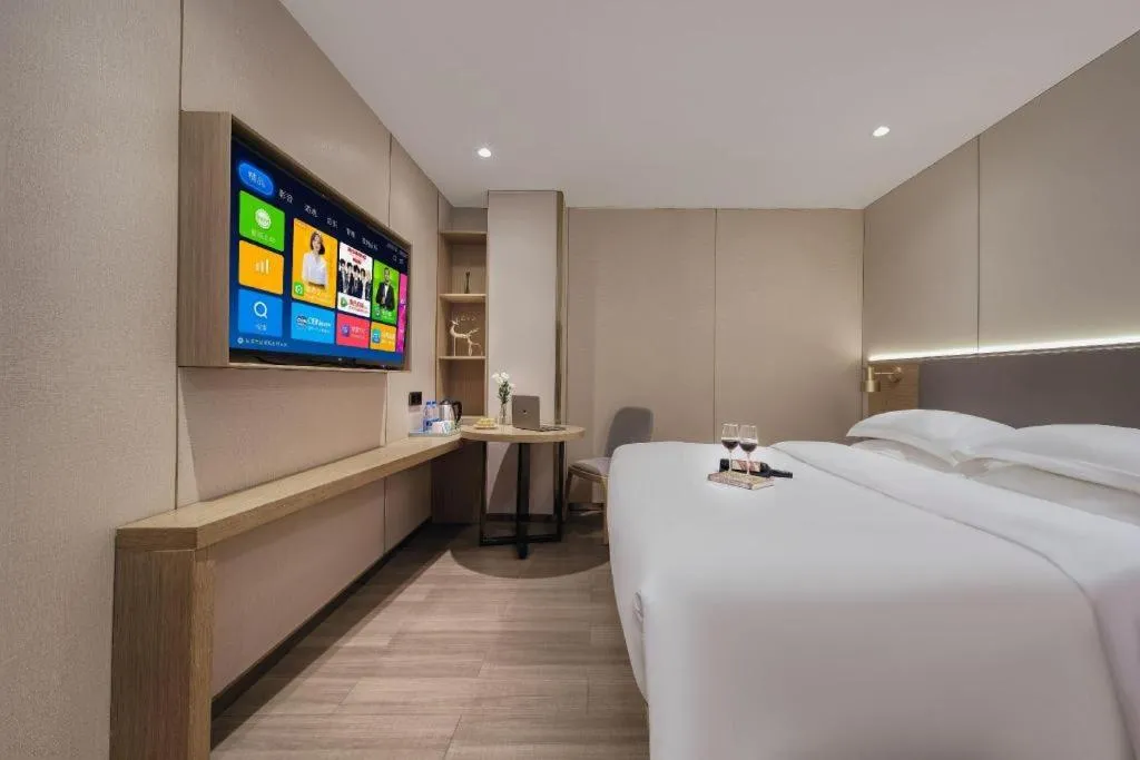 Bed in Echarm Hotel Guangzhou Gangding Huashi Metro Station