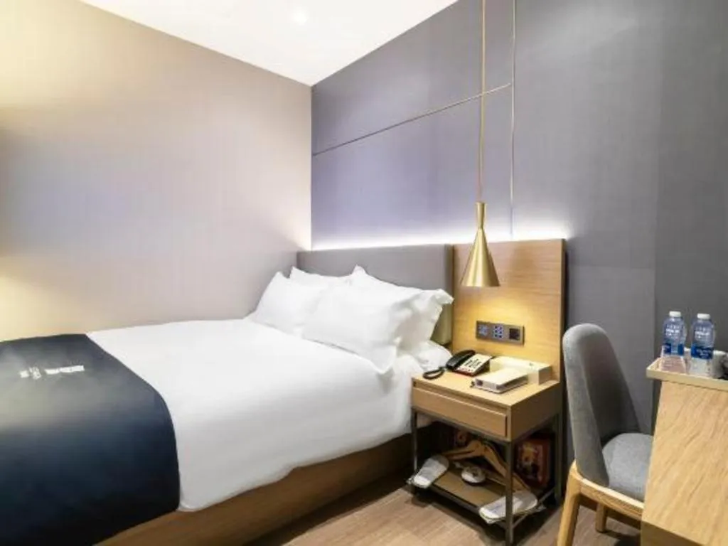 Bed in Echarm Hotel Guangzhou Gangding Huashi Metro Station