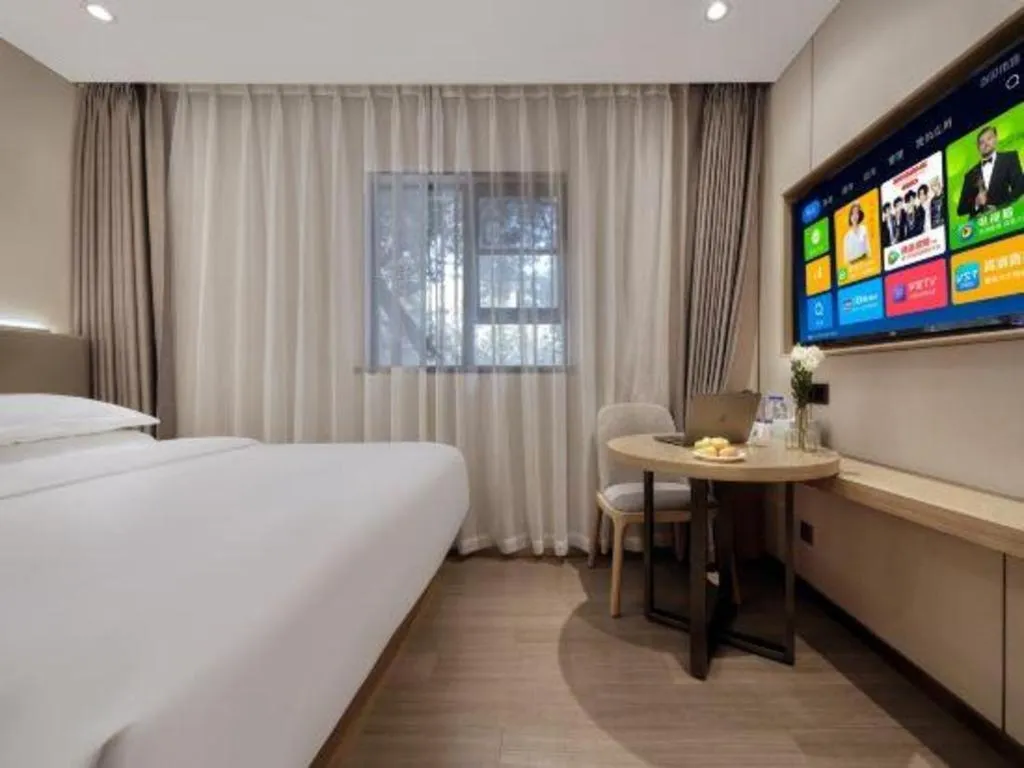 Bed in Echarm Hotel Guangzhou Gangding Huashi Metro Station