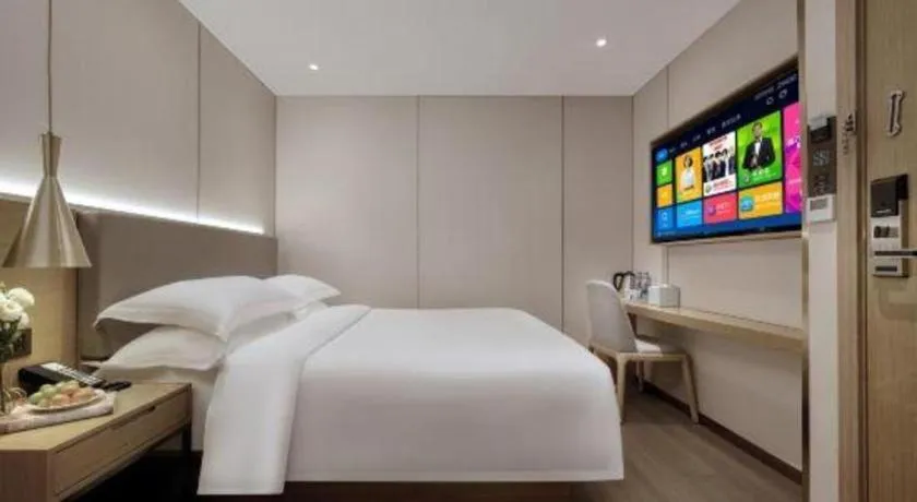 Bed in Echarm Hotel Guangzhou Gangding Huashi Metro Station