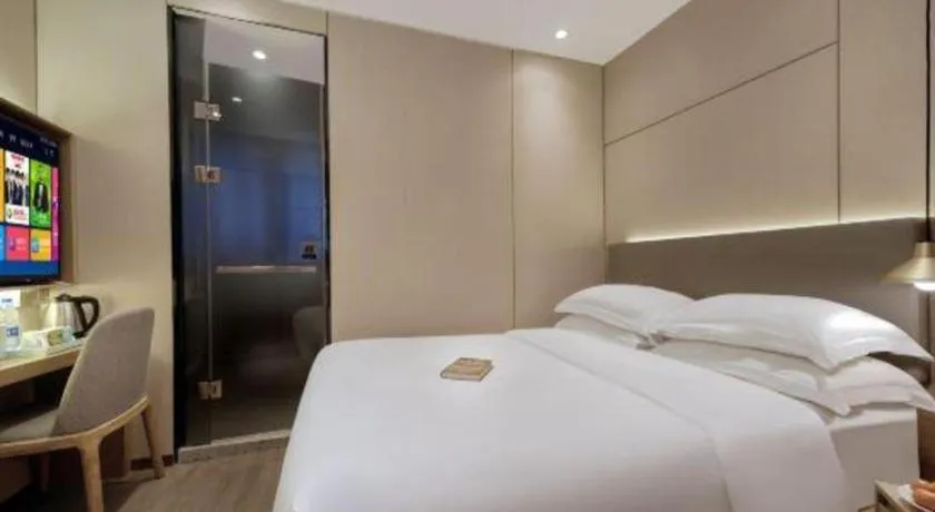 Bed in Echarm Hotel Guangzhou Gangding Huashi Metro Station