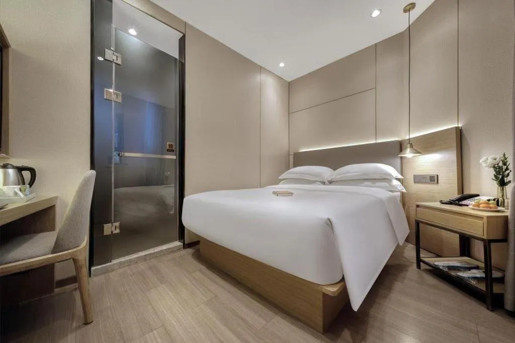 Bed in Echarm Hotel Guangzhou Gangding Huashi Metro Station